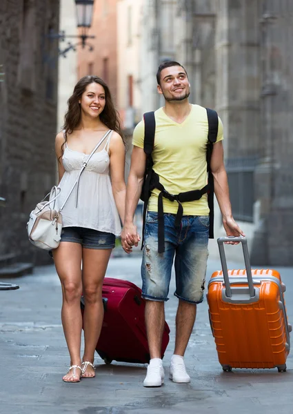 Travelers with  suitcases