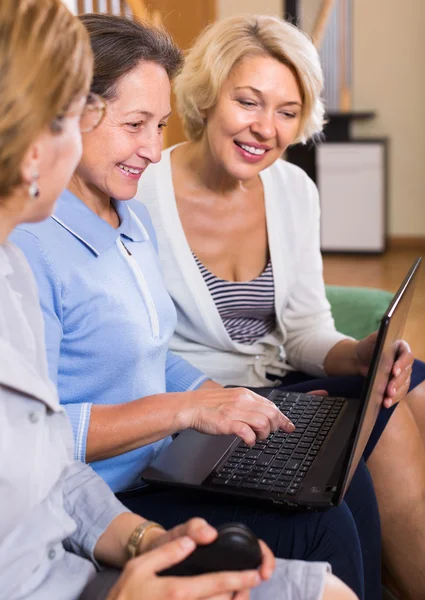 Senior ladies with laptop