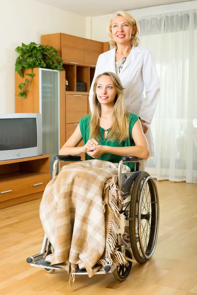 Doctor visiting handicapped