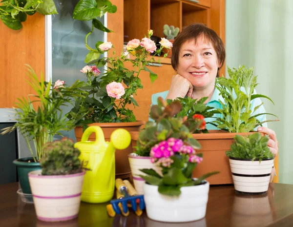 Grandmother gardener with plants