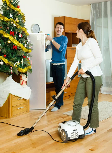 Happy man and woman cleaning