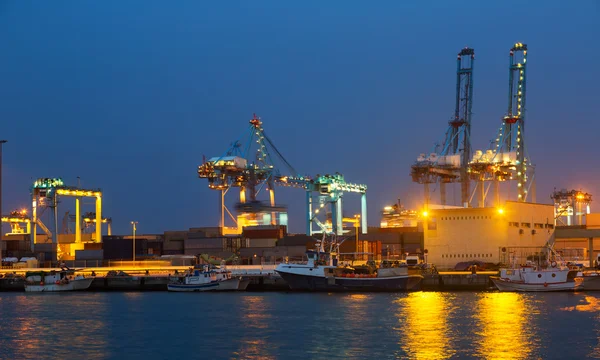 Night view of cranes in seaport.