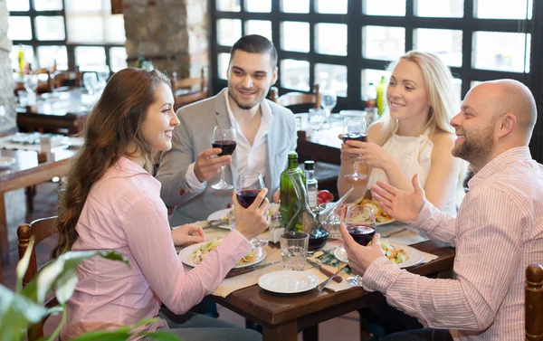 Young people enjoying food at tavern