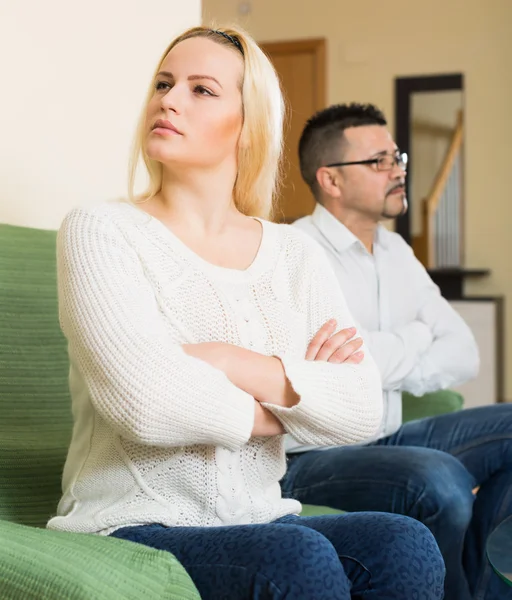 Unhappy woman and man after quarrel