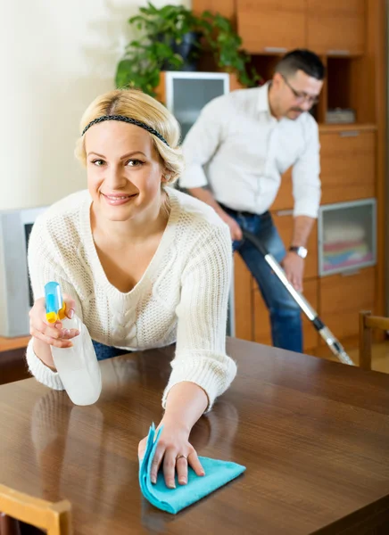 Family couple cleaning at home