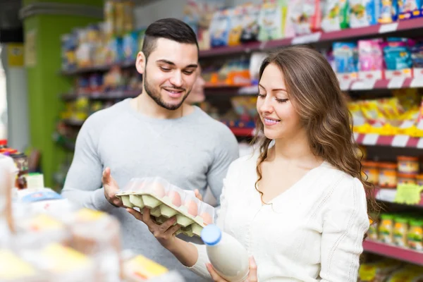 Happy couple purchasing food