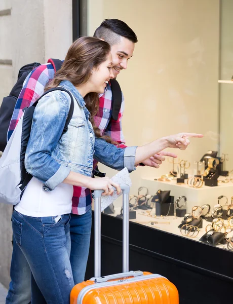 Travellers looking at expensive watches