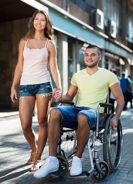 Woman and her disabled husband