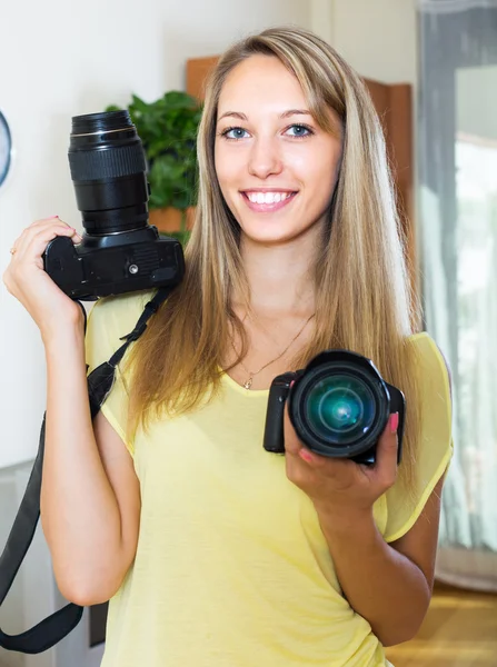 Girl testing  professional cameras