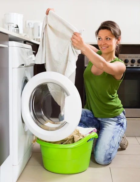 Girl using washing machine