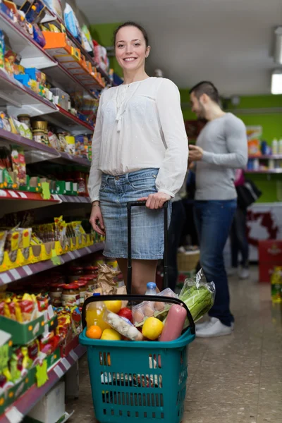 People purchasing food at supermarket