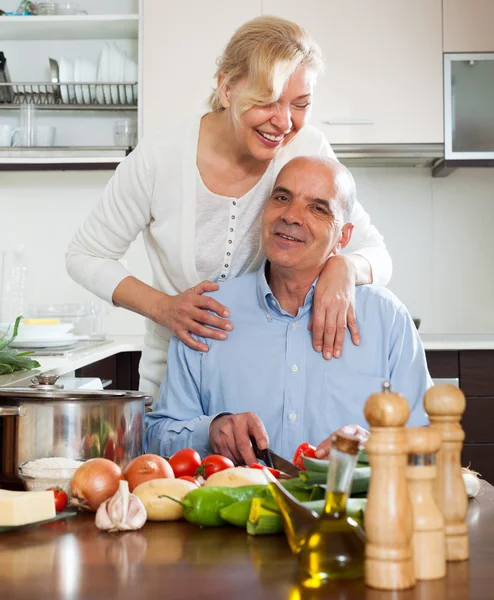 Mature couple cooking