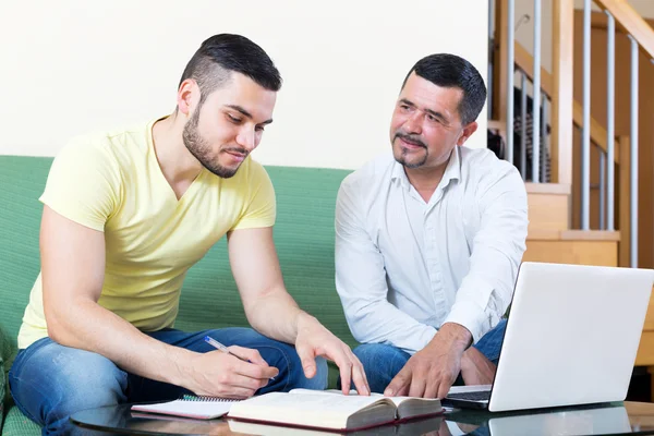 Father helping his son