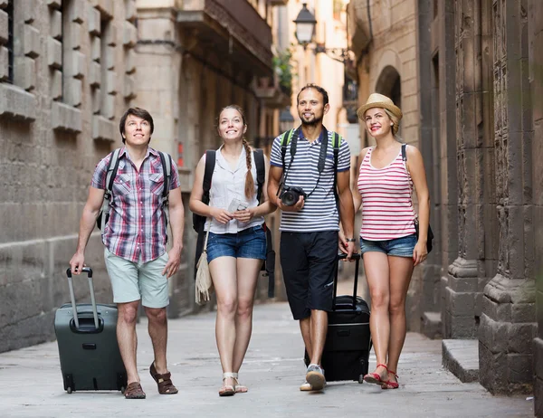 Merry travelers walking the street