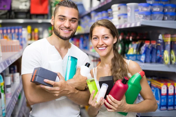 Couple with shampoo in the store