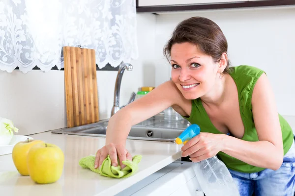 Woman cleaning dust and grease