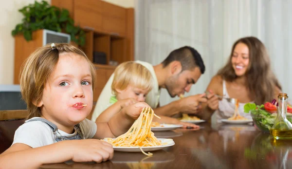 Family eating spaghetti