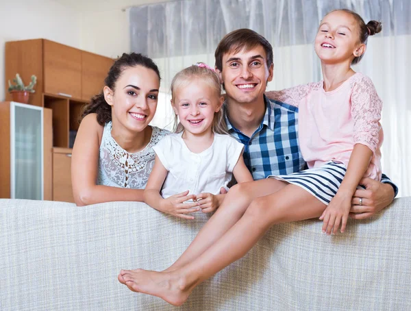 Relaxed family in domestic interior