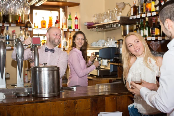 Bartender entertaining guests