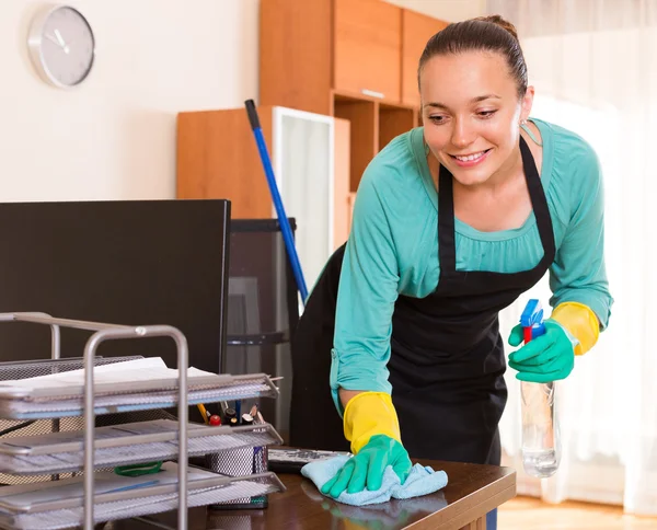 Woman cleaning office room