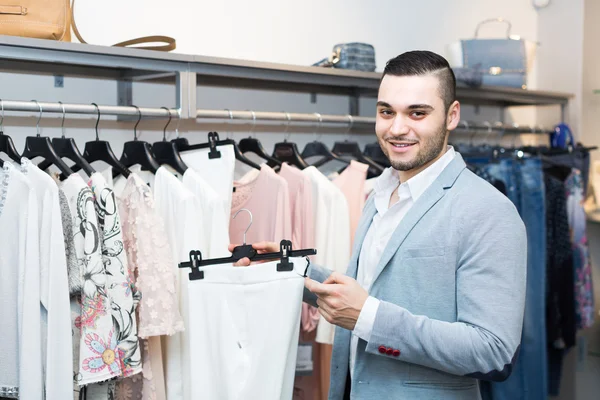 Man buying clothes for girlfriend