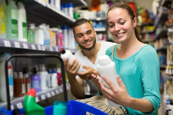 Girl and her husband buying shampoo