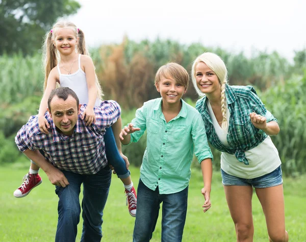 Family with kids enjoying vacation in village