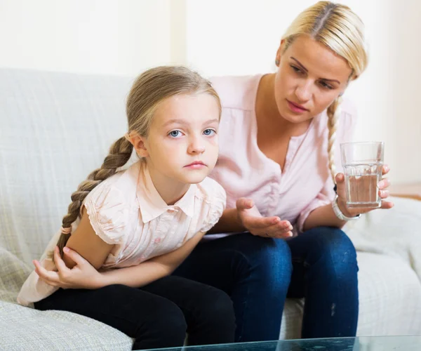 Woman and child with abdominal pains