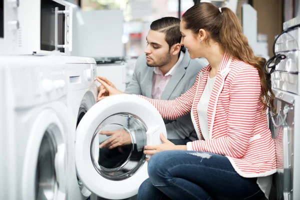 Couple buying new clothes washer