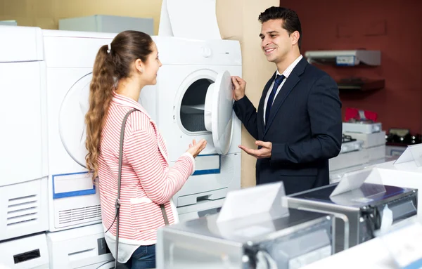 Woman buying new clothes washer