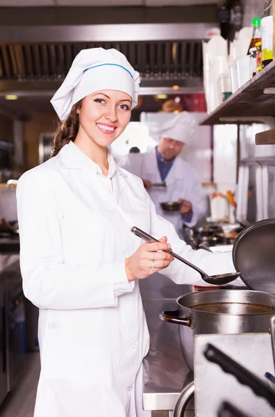 Cooks greeting customers at bistro