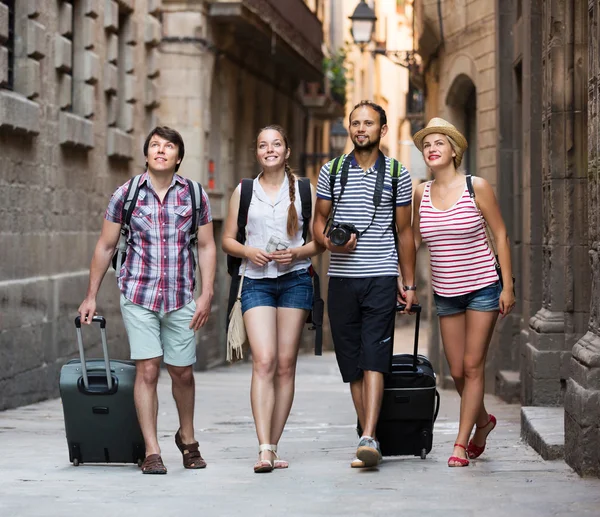 Travelers with travel bags walking