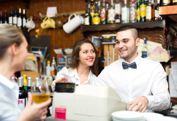 Beautiful employees working in bar