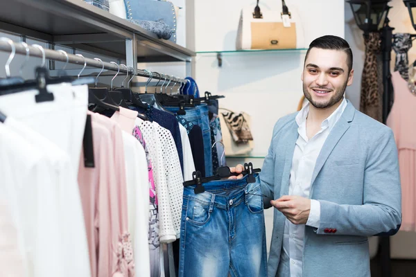 Man buying clothes for girlfriend