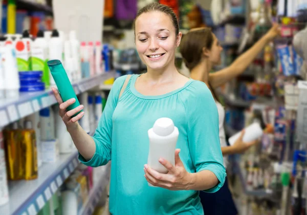 Girl buying shampoo
