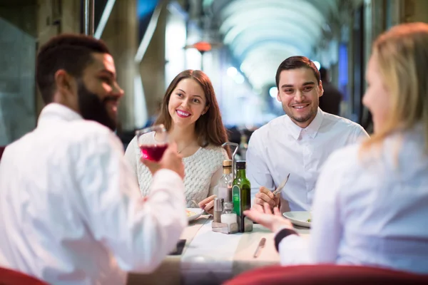 Middle class people enjoying food in cafe terrace