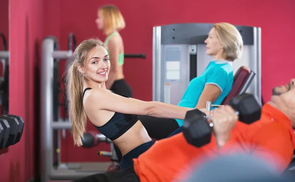 People  weightlifting training in health club