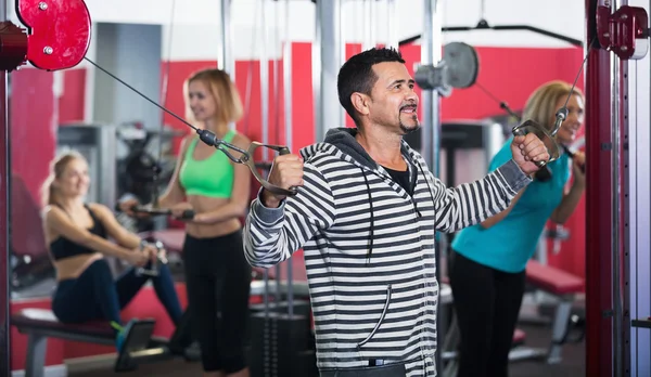 People  weightlifting training in health club