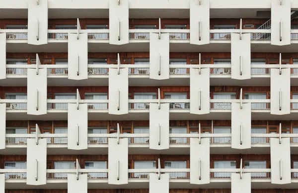 Background of the facade. Repeating pattern of windows and balco