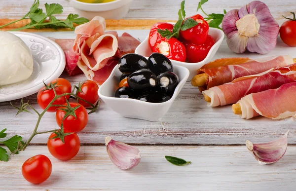 Mixed Antipasto on a wooden table