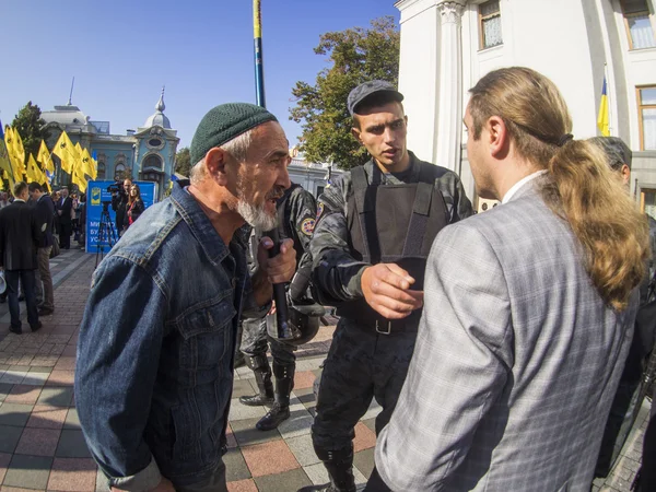 Yuri Miroshnichenko talks with activist