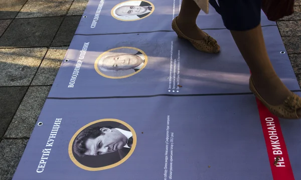 Women trampled portraits of politicians