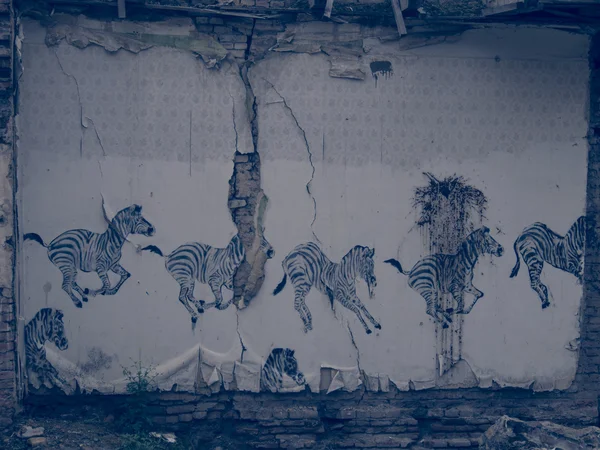 Wallpaper with zebras in demolished house