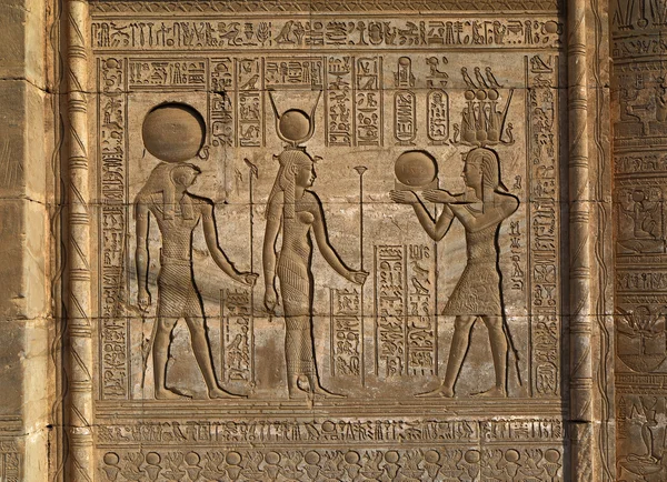 Hieroglyphic carvings in ancient egyptian temple