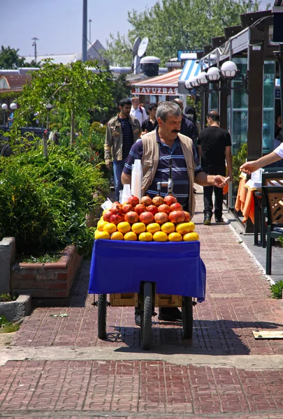 Man sells fruit juice on the street of Istanbul