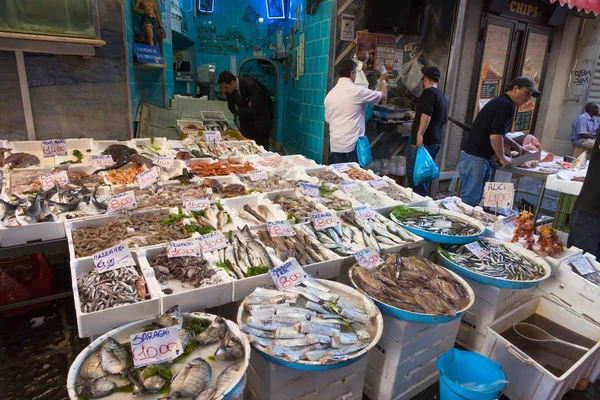 Typical outdoor Italian fish market with fresh fish and seafood,