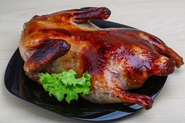 Roasted duck on the wood background