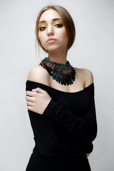 Portrait of young beautiful woman with handmade jewelry