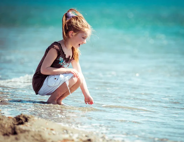 Little girl on tropical beach