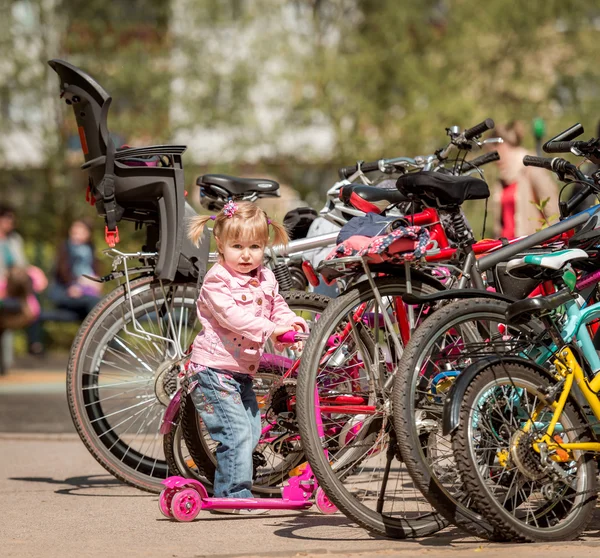 Little girl with her scooter